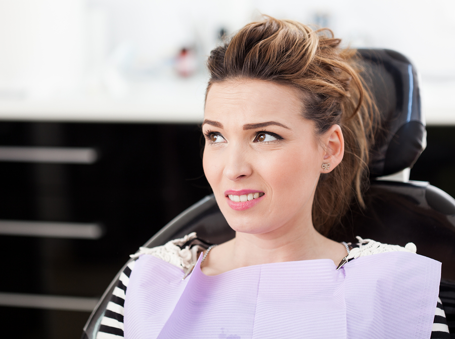 Worried Woman Patient Waiting To Be Checked Up At The Dentist