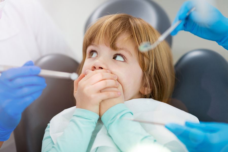 A child refuses to open the mouth for dental check-up.